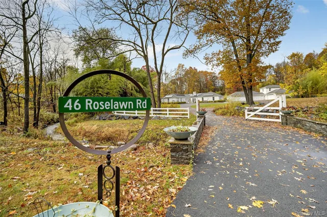 a view of swimming pool with sitting area