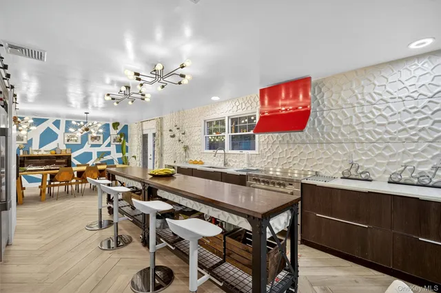 a view of a dining room with furniture and chandelier