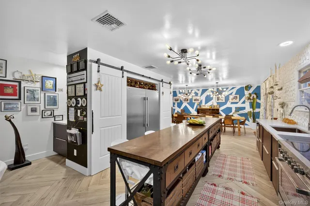 a view of a kitchen and a living room