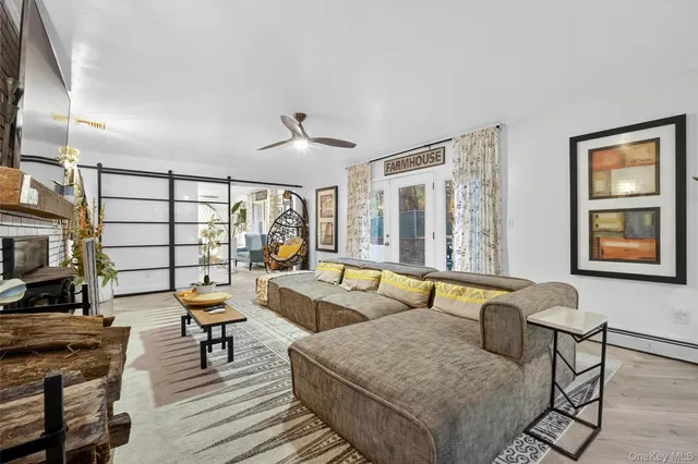 a living room with furniture and a large window