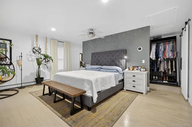 a bed room with a bed and a lamp