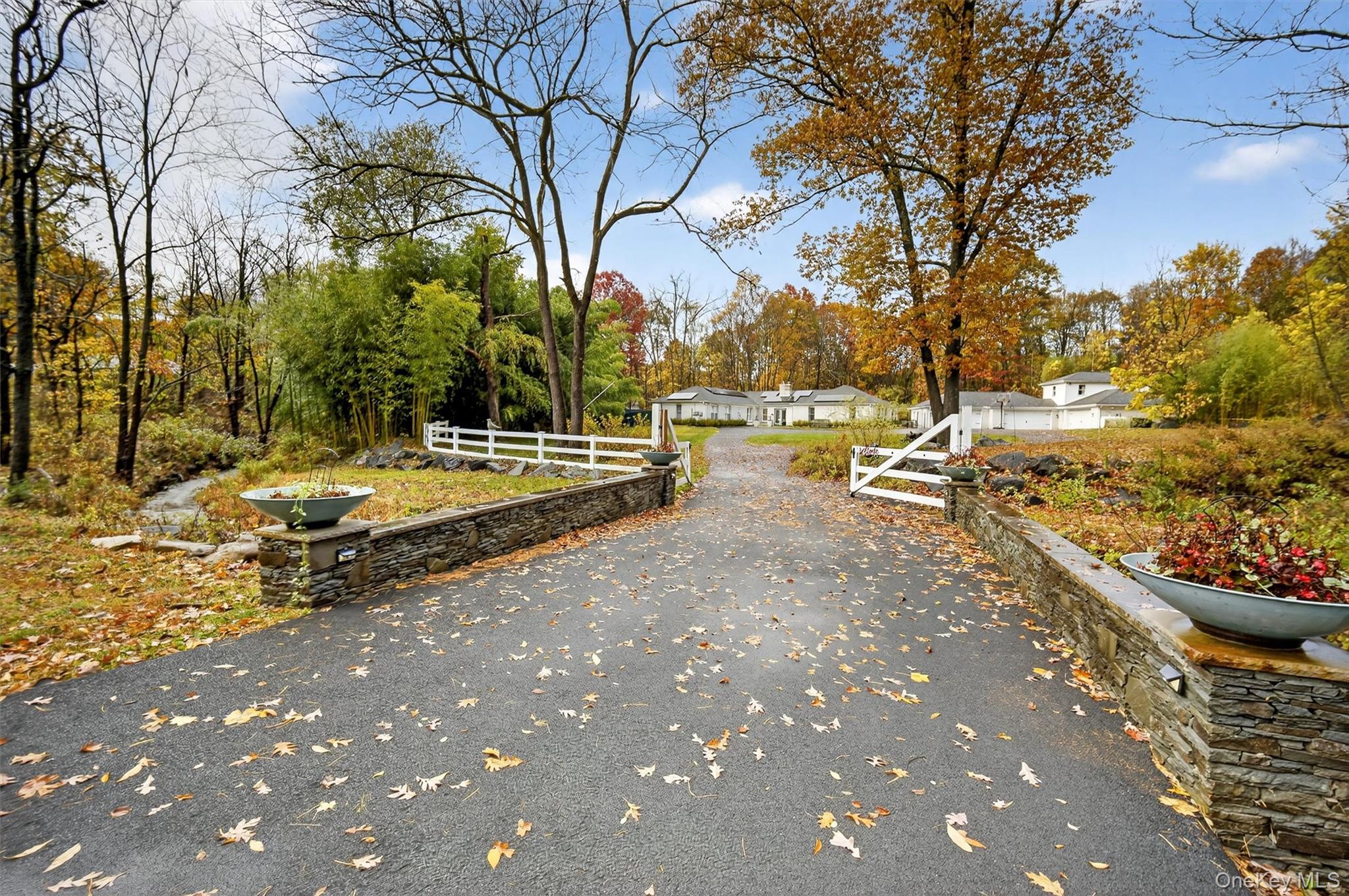 46 Roselawn Road Highland Mills, NY 10930 - Photo 3 of 49 a view of backyard with wooden fence and large trees