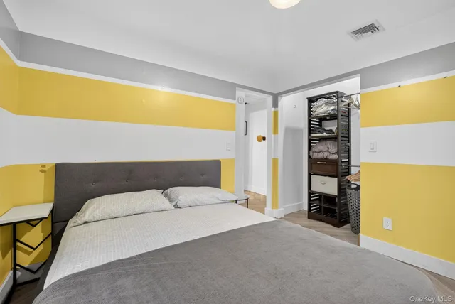 a bedroom with a bed and a couch