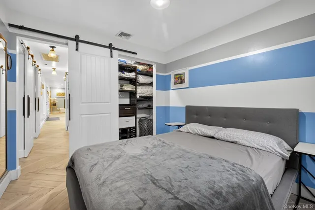a bedroom with a bed and a walk in closet