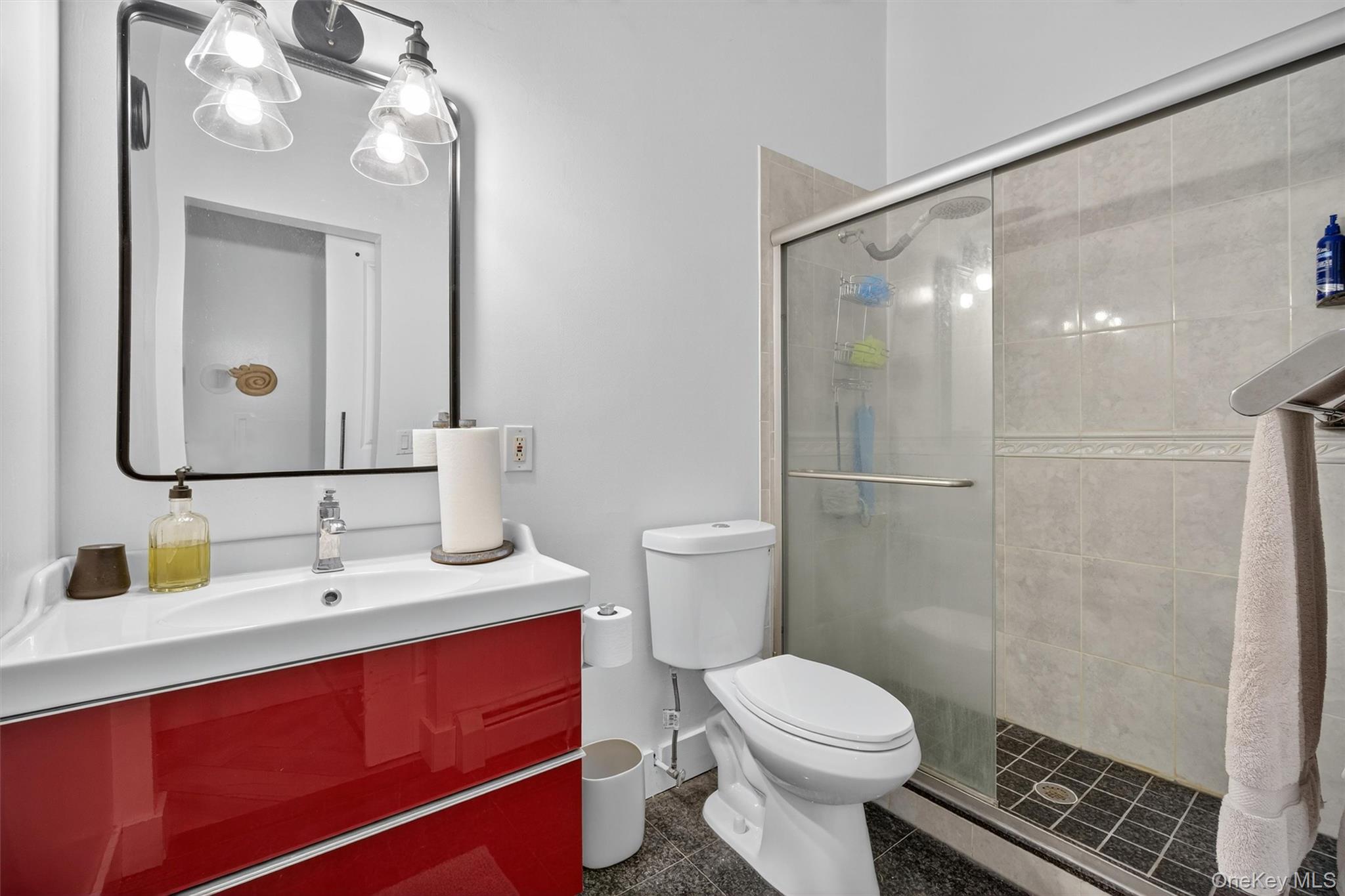 46 Roselawn Road Highland Mills, NY 10930 - Photo 39 of 49 a bathroom with a sink a toilet and shower