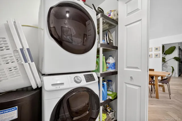 a view of a hallway with washer and dryer
