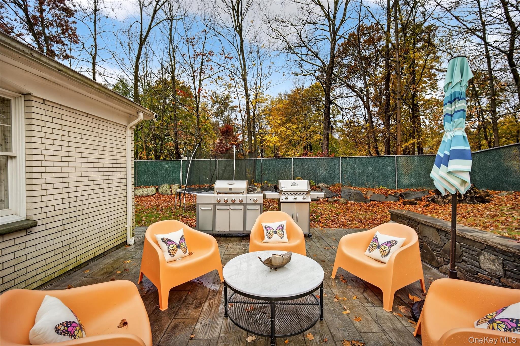 46 Roselawn Road Highland Mills, NY 10930 - Photo 41 of 49 a view of a patio with couches chairs and a fire pit