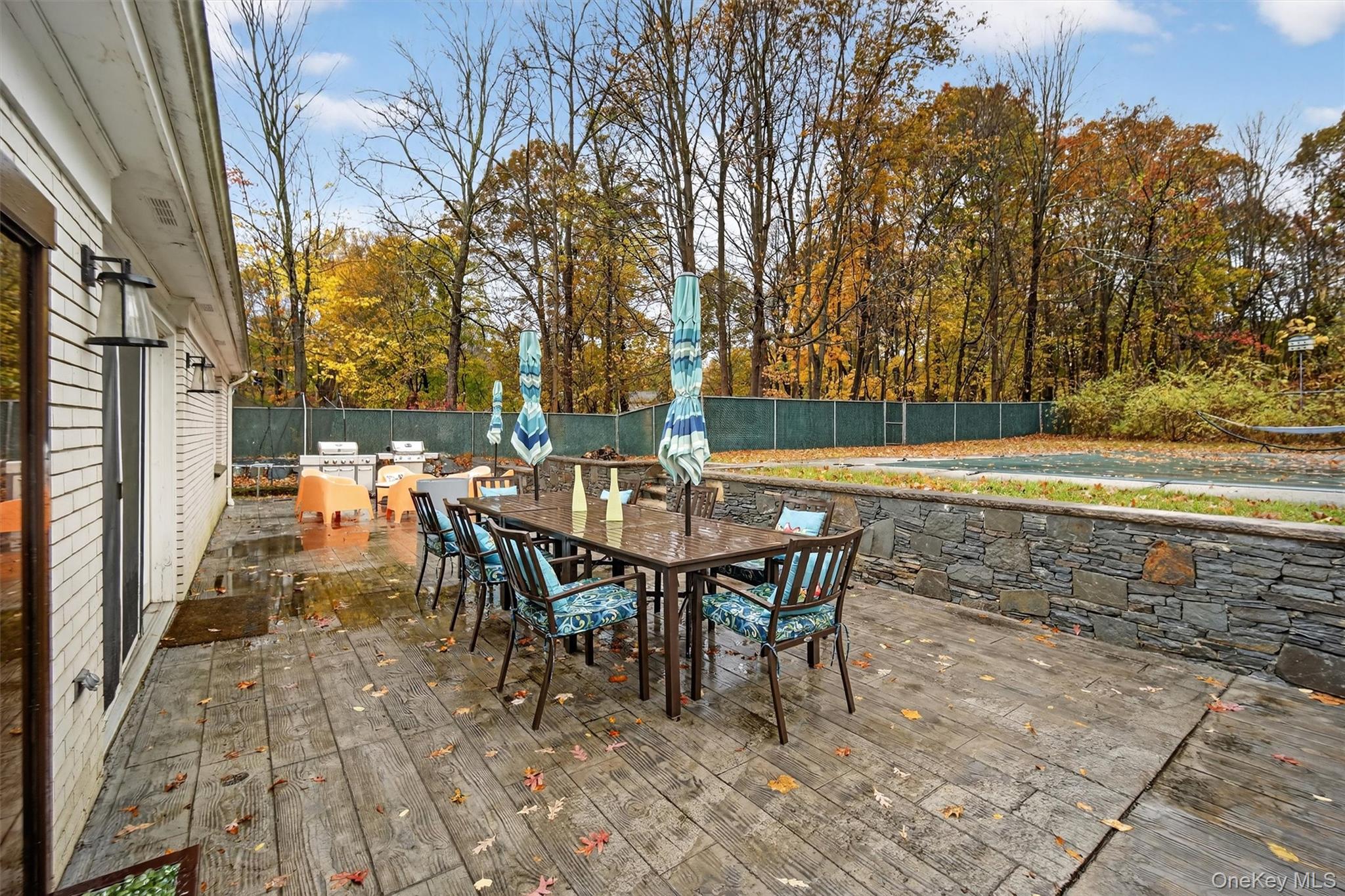 46 Roselawn Road Highland Mills, NY 10930 - Photo 42 of 49 a view of a patio with table and chairs and potted plants