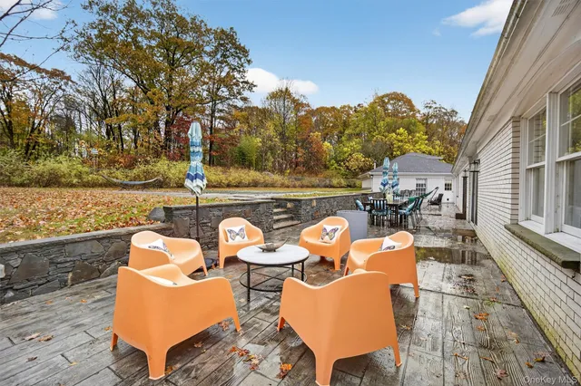 an outdoor space with lounge chair