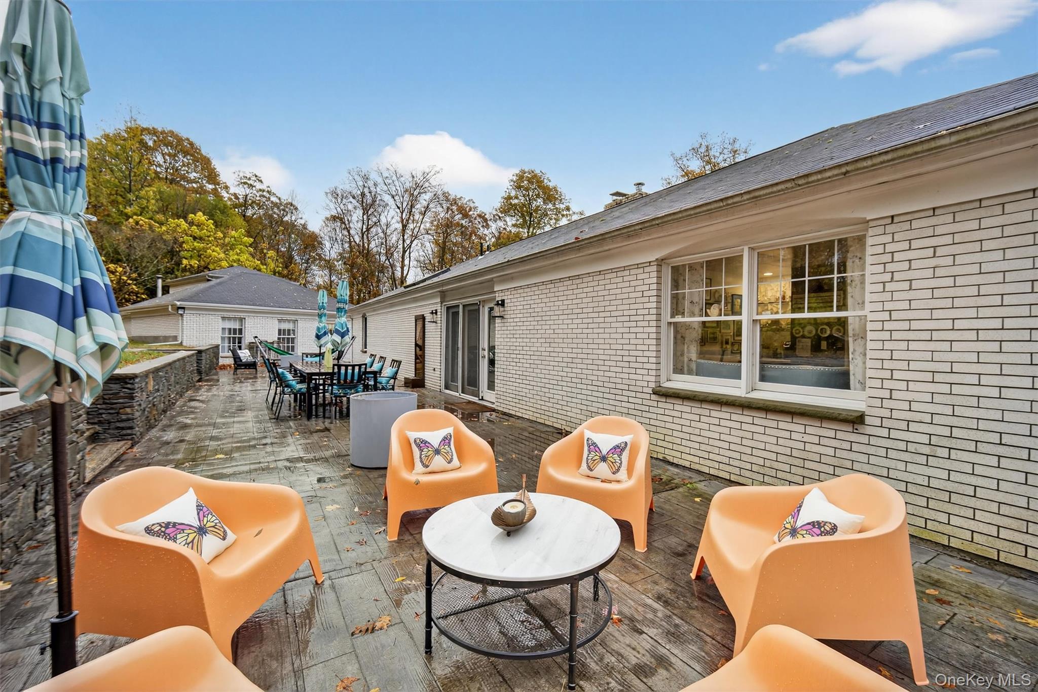 46 Roselawn Road Highland Mills, NY 10930 - Photo 44 of 49 a backyard of a house with wooden floor a fire pit and outdoor seating