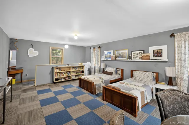 a living room with furniture and a rug