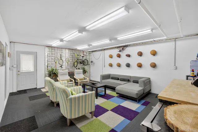 a living room with furniture and a rug