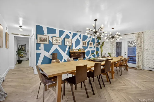 a view of a dining room with furniture and wooden floor