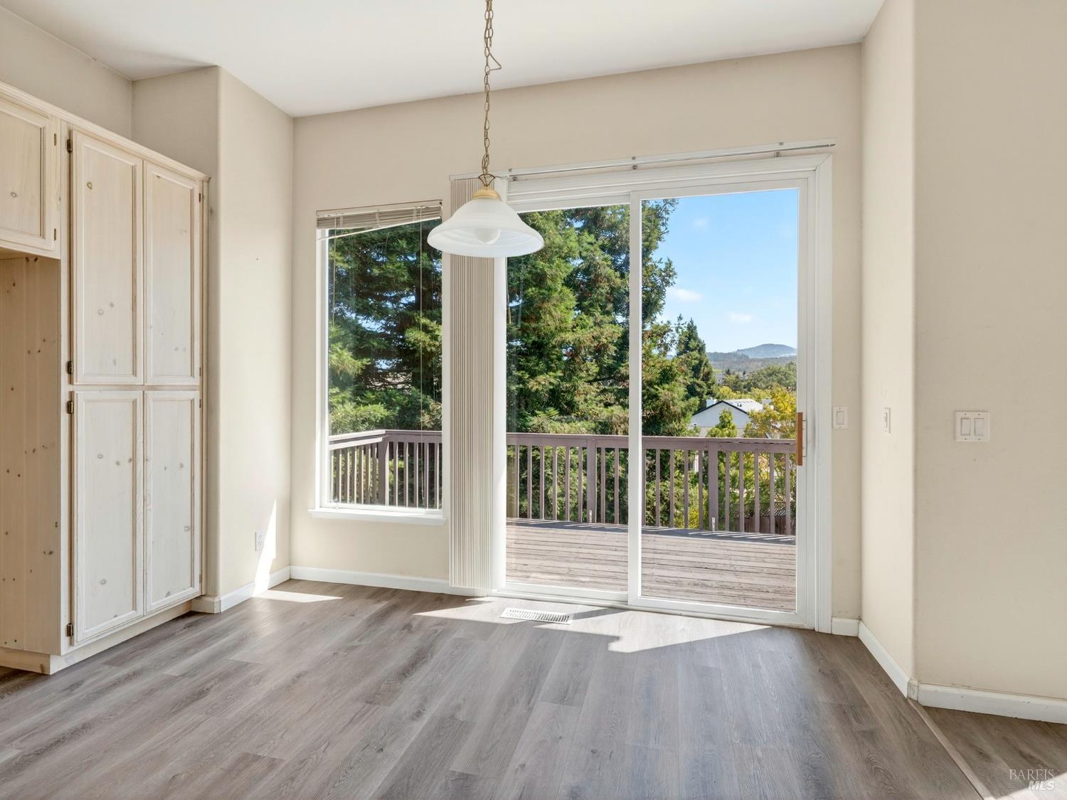 5794 Owl Hill Avenue Santa Rosa, CA 95409 - Photo 17 of 56 a view of an empty room with wooden floor and fan