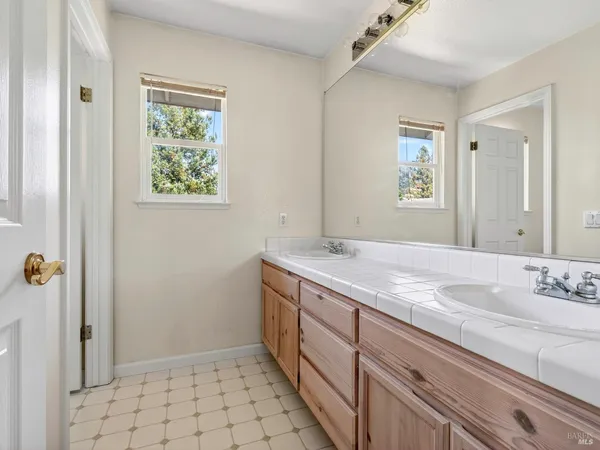 a view of a kitchen with white cabinets