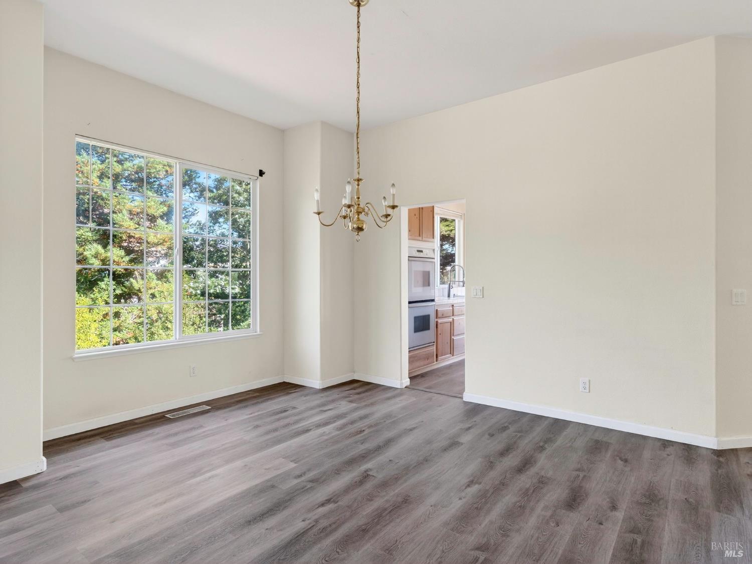 5794 Owl Hill Avenue Santa Rosa, CA 95409 - Photo 5 of 56 a view of empty room with wooden floor and fan