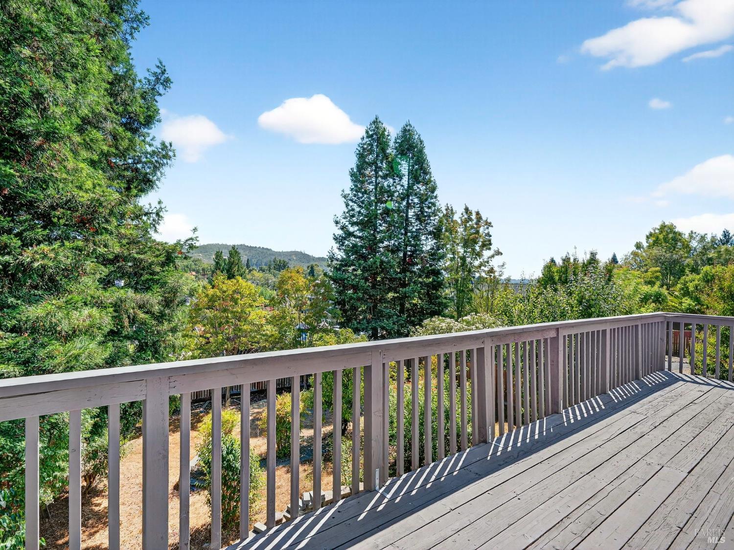 5794 Owl Hill Avenue Santa Rosa, CA 95409 - Photo 51 of 56 a balcony with wooden floor and yard in the back