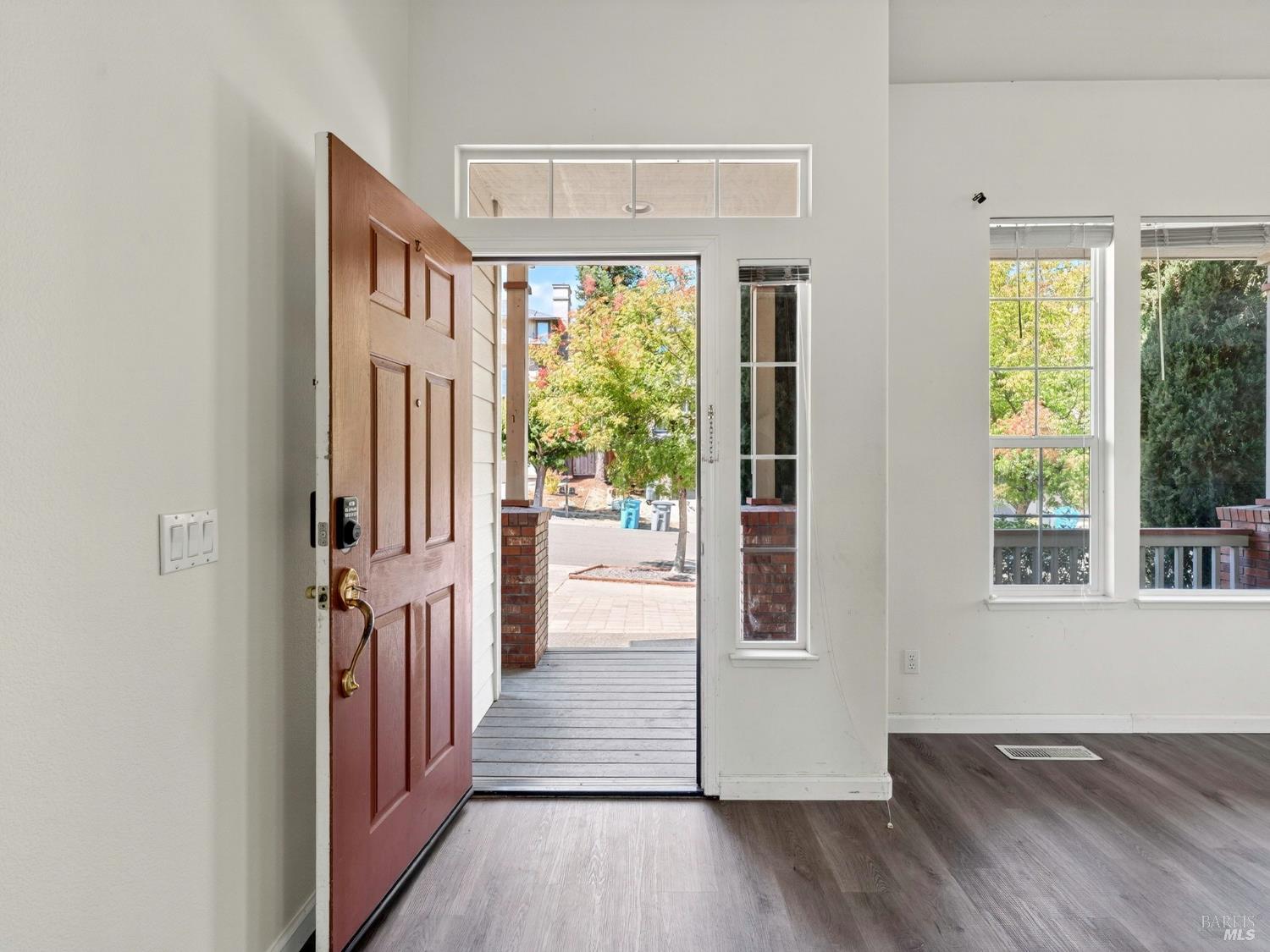 5794 Owl Hill Avenue Santa Rosa, CA 95409 - Photo 8 of 56 a view of a hallway with wooden floor and stairs