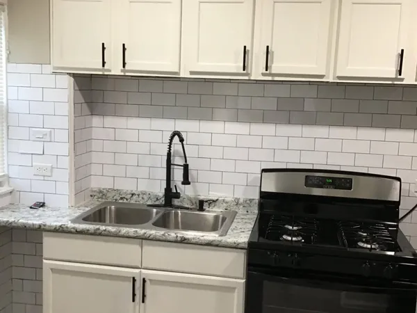 a kitchen with a sink and cabinets