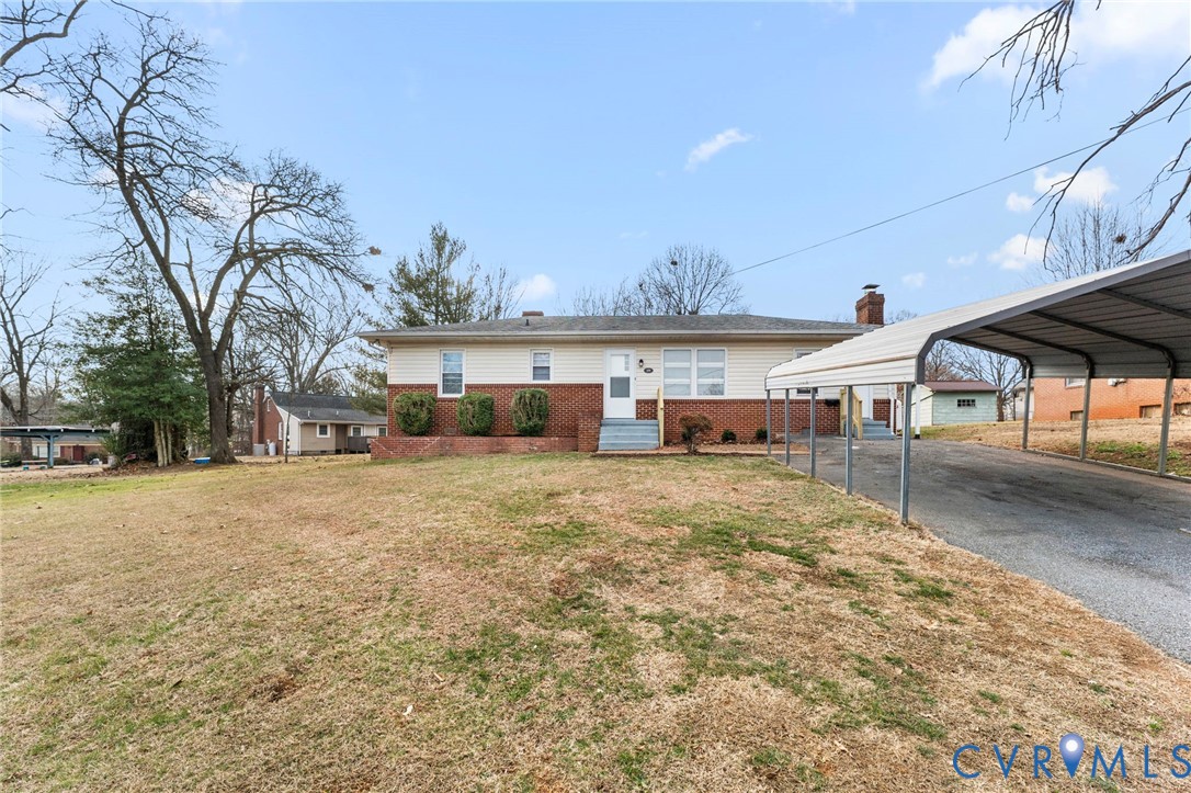 159 2nd Street Appomattox, VA 24522 - Photo 1 of 30 a front view of a house with a yard and a garage