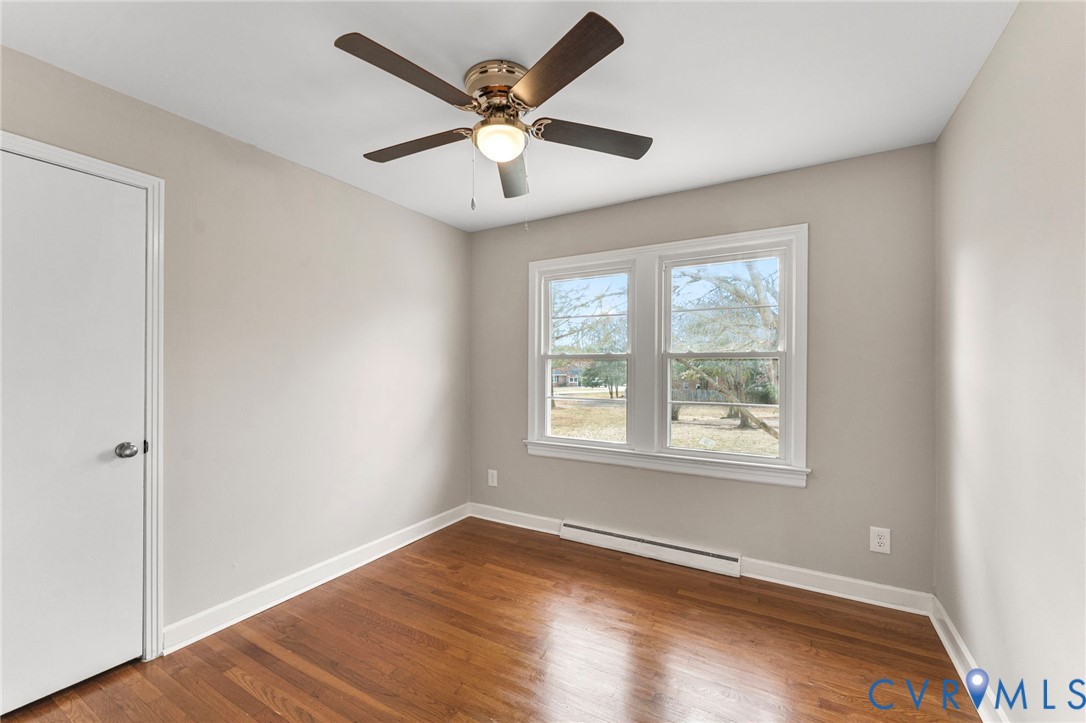 159 2nd Street Appomattox, VA 24522 - Photo 16 of 30 an empty room with wooden floor and windows