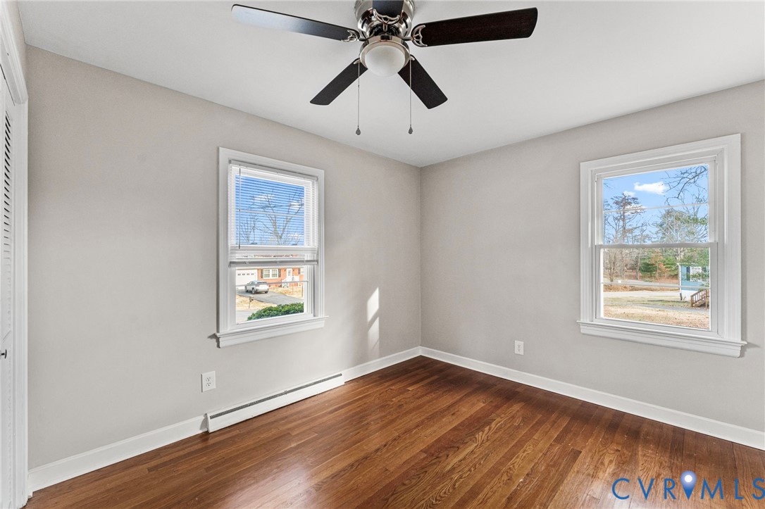 159 2nd Street Appomattox, VA 24522 - Photo 19 of 30 a view of an empty room with wooden floor and a window