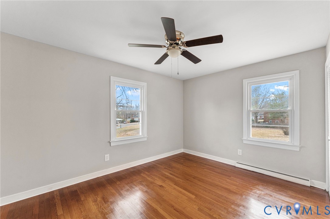 159 2nd Street Appomattox, VA 24522 - Photo 23 of 30 a view of an empty room with wooden floor and a window