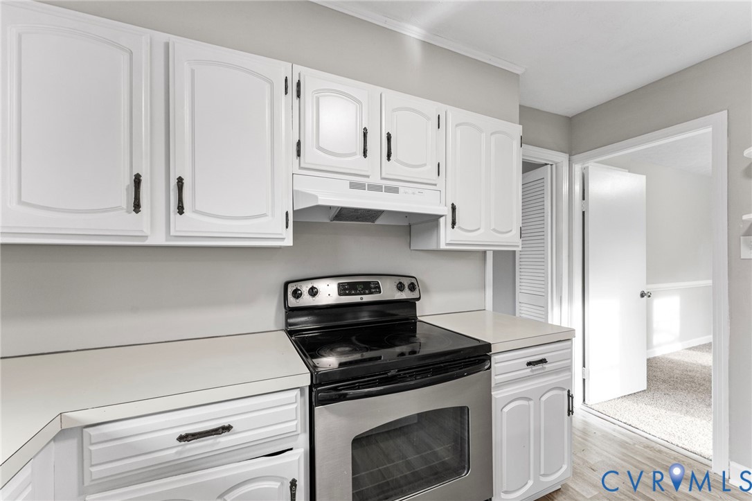 159 2nd Street Appomattox, VA 24522 - Photo 9 of 30 a kitchen with white cabinets and appliances