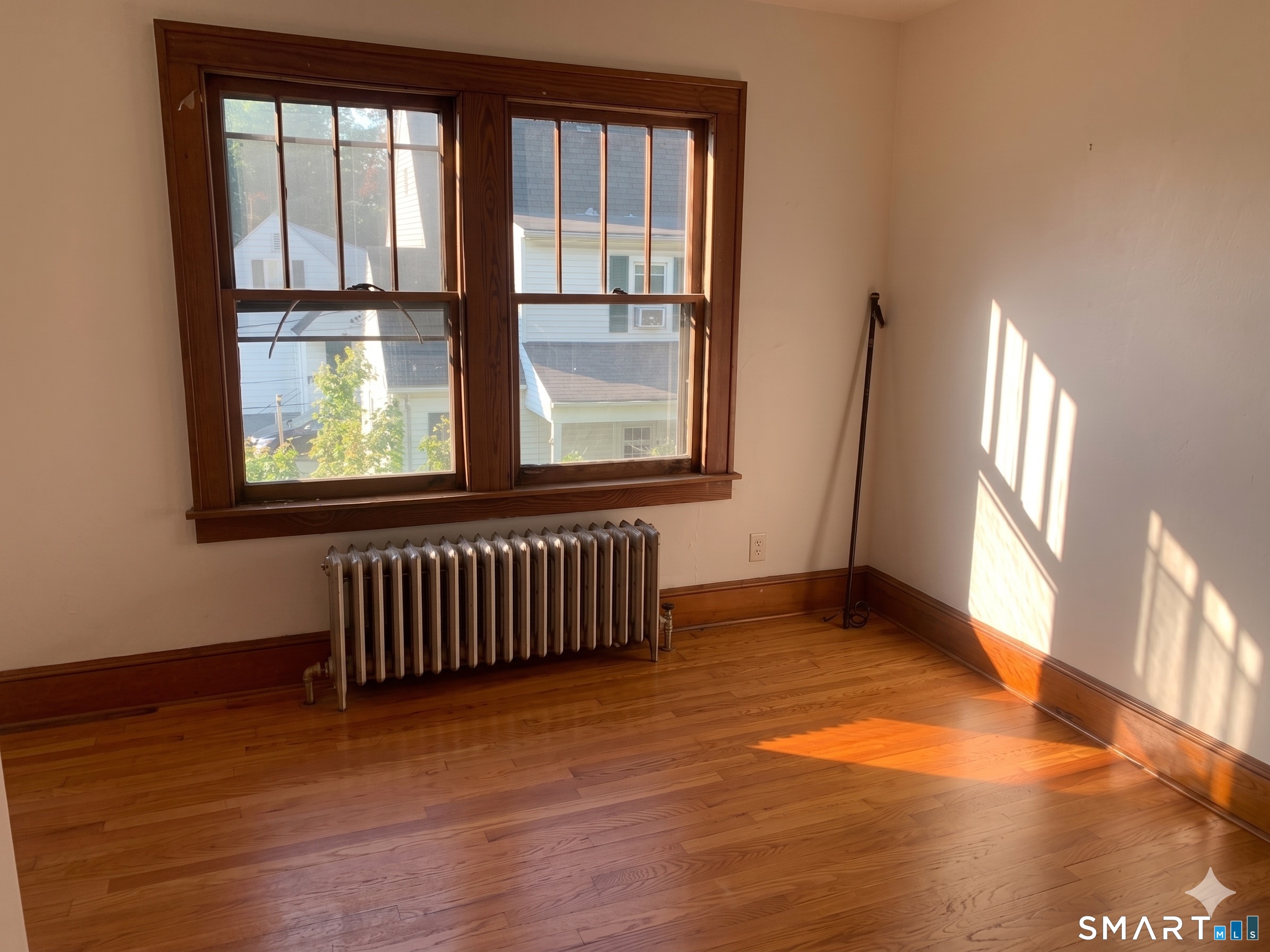 44 Bird Street Torrington, CT 06790 - Photo 10 of 17 an empty room with wooden floor and windows