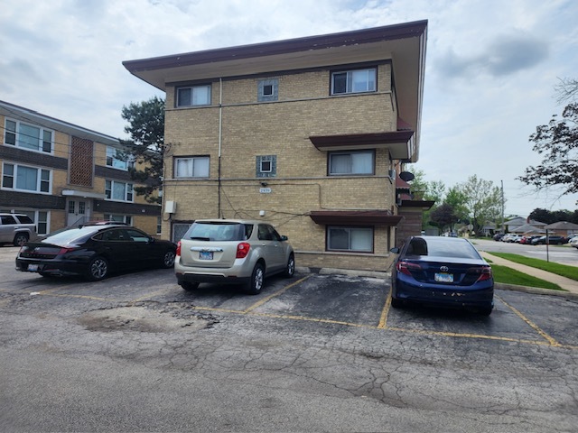 2939 South 13th Avenue, Unit 2N Broadview, IL 60155 - Photo 18 of 18 a car parked in front of a house