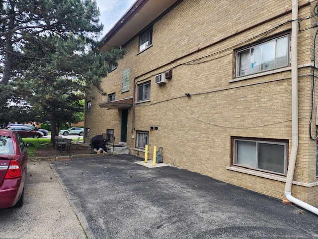 2939 South 13th Avenue, Unit 2N Broadview, IL 60155 - Photo 2 of 18 a view of a car park in front of house