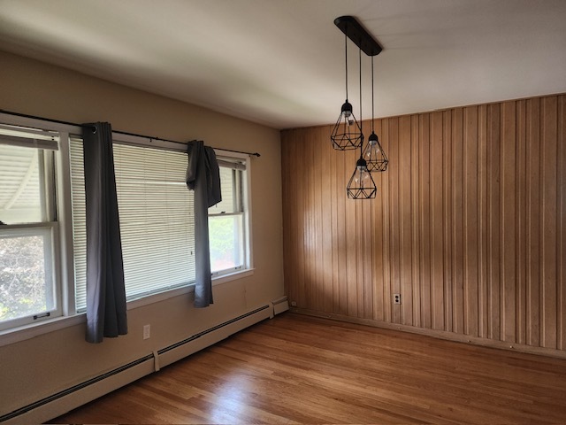 2939 South 13th Avenue, Unit 2N Broadview, IL 60155 - Photo 7 of 18 a view of empty room with wooden floor and fan