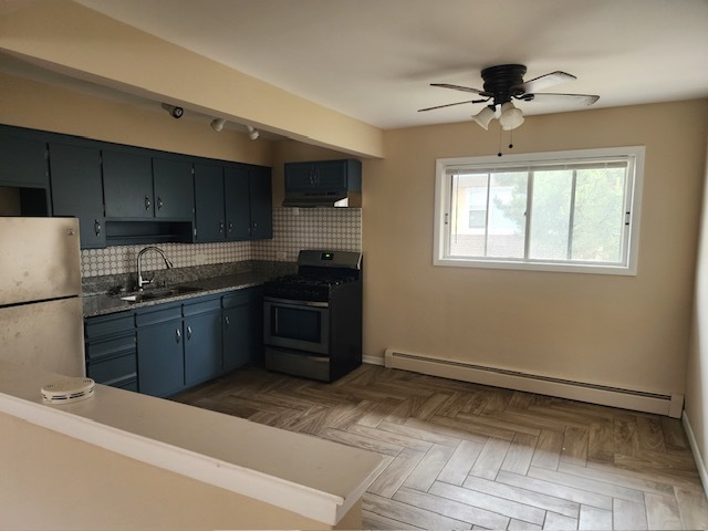 2939 South 13th Avenue, Unit 2N Broadview, IL 60155 - Photo 8 of 18 a kitchen with a sink appliances and cabinets