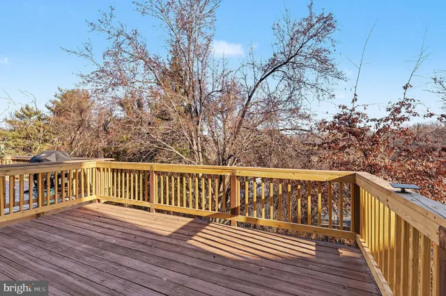 a view of deck with wooden floor and fence