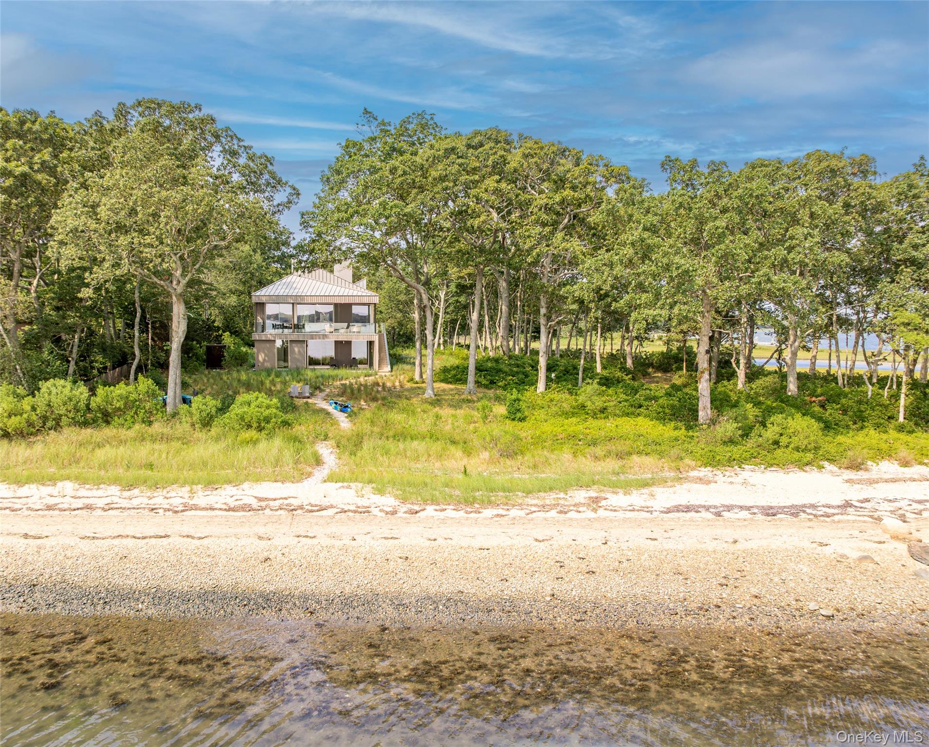 47 L South Ferry Road Shelter Island, NY 11964 - Photo 2 of 35 Beach home featuring a water view and a chimney