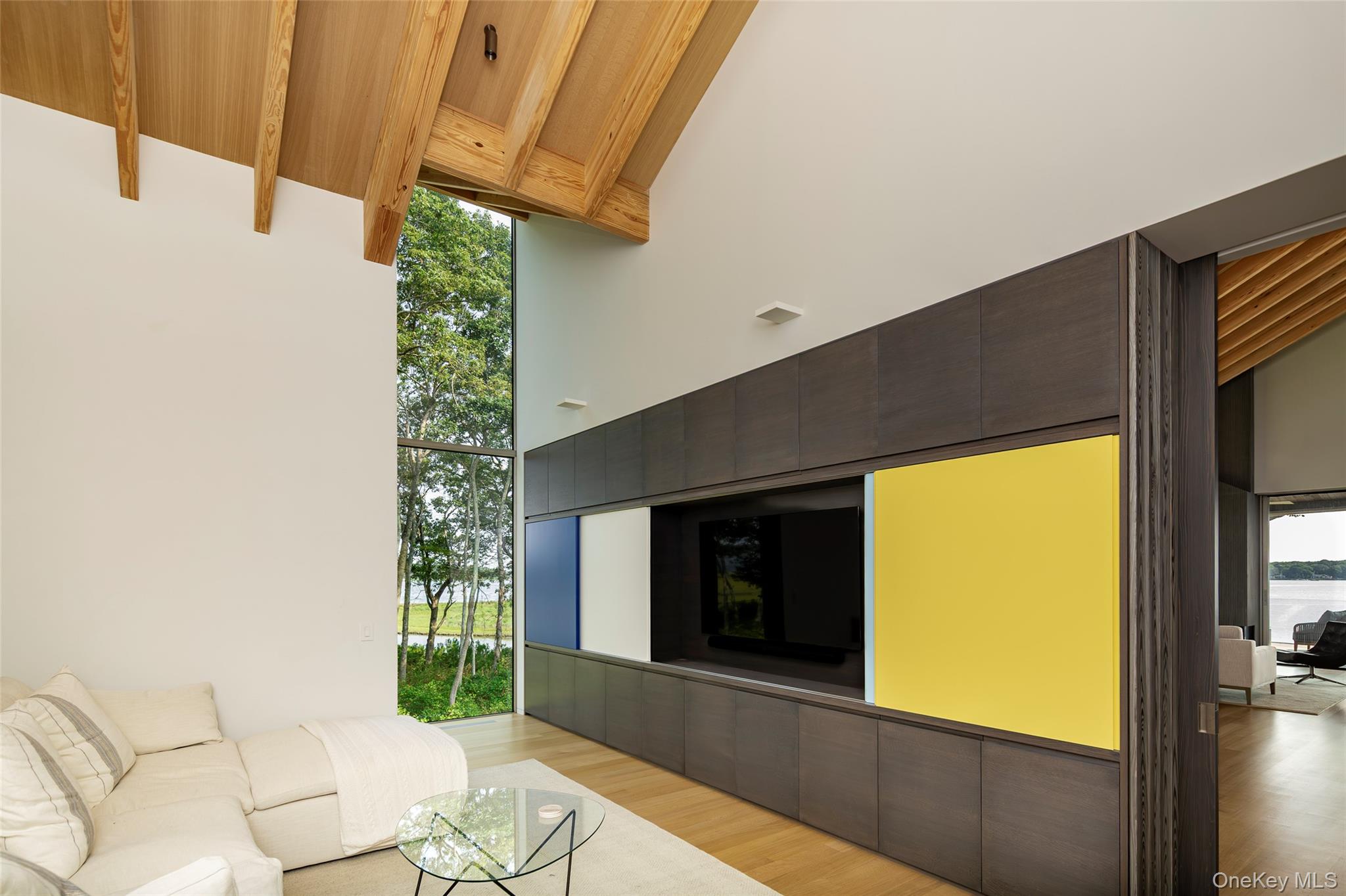 47 L South Ferry Road Shelter Island, NY 11964 - Photo 20 of 35 Living room featuring light wood-style flooring, high vaulted ceiling, and a wooden ceiling with exposed beams