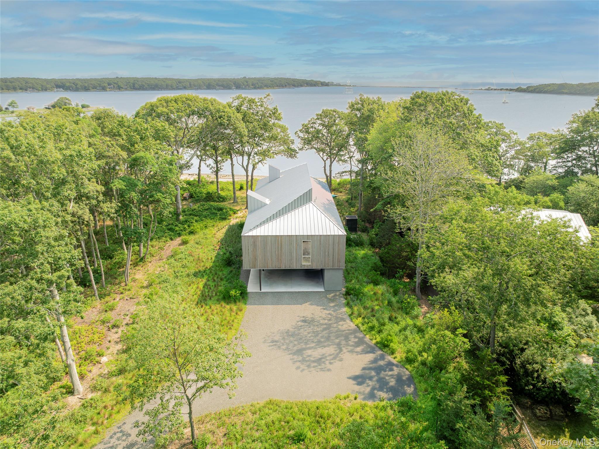 47 L South Ferry Road Shelter Island, NY 11964 - Photo 28 of 35 Aerial view of property and surrounding area with a large body of water