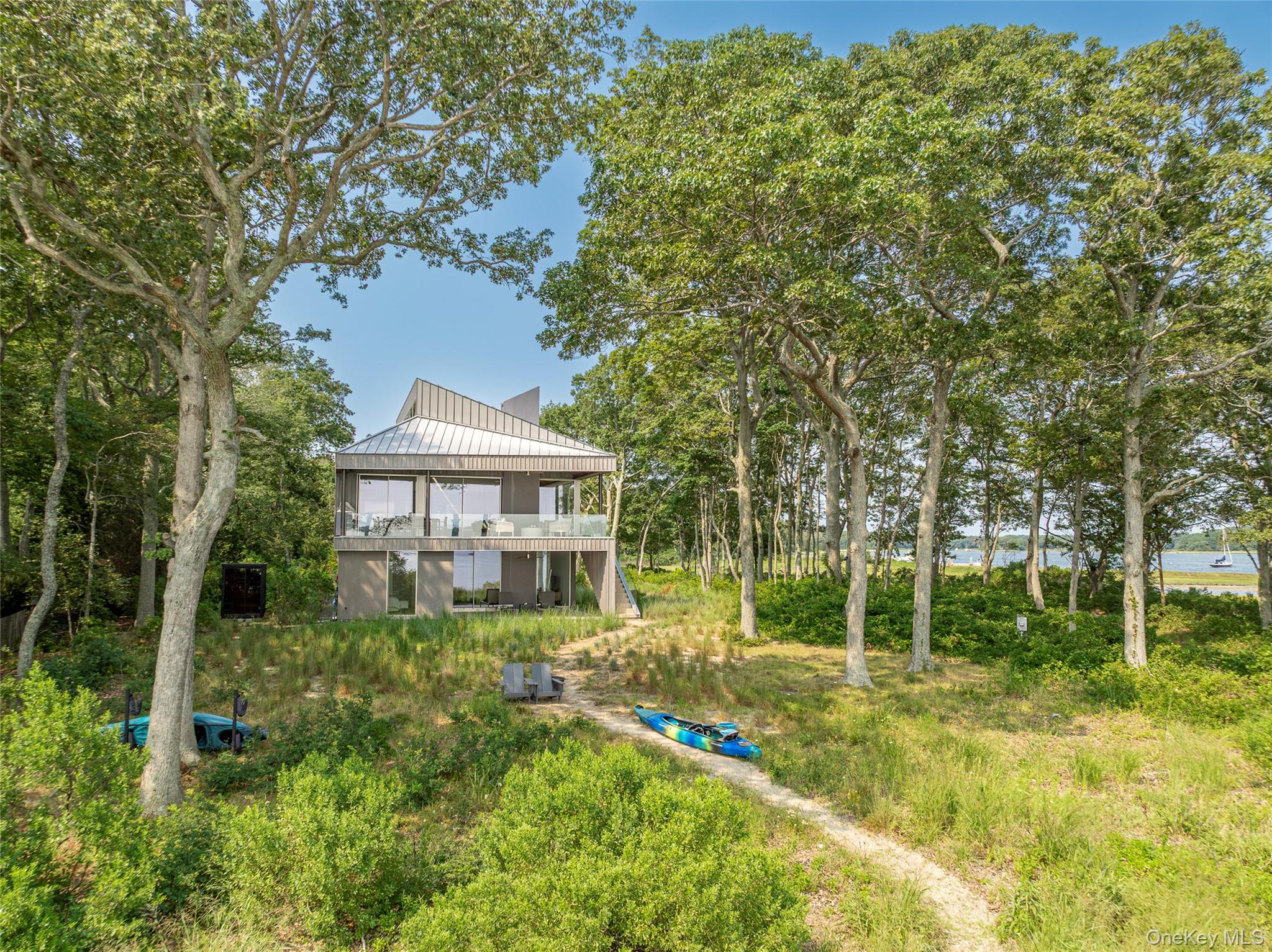 47 L South Ferry Road Shelter Island, NY 11964 - Photo 30 of 35 Rear view of property with a standing seam roof and a metal roof