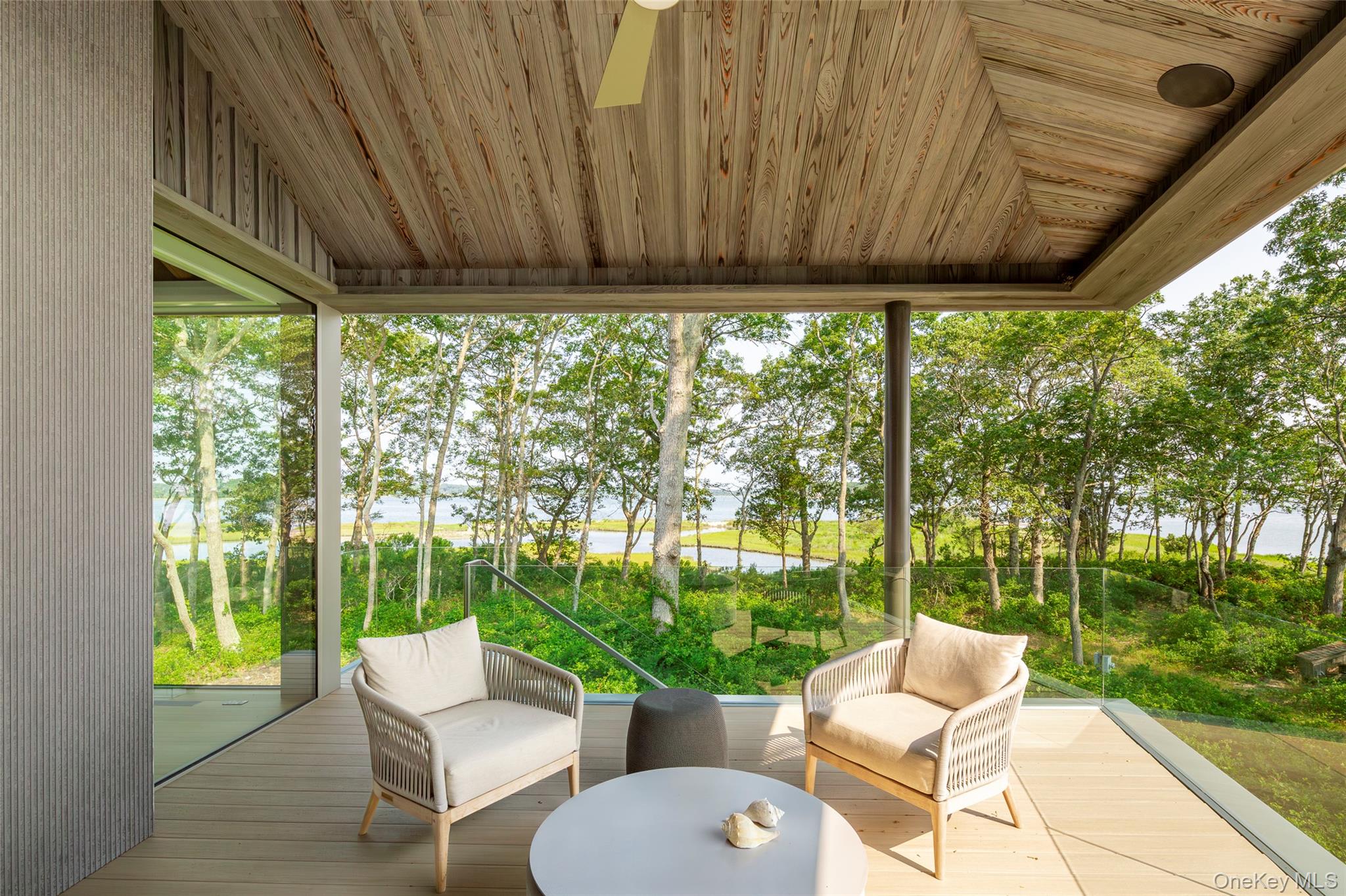 47 L South Ferry Road Shelter Island, NY 11964 - Photo 6 of 35 Sunroom / solarium with vaulted ceiling and healthy amount of natural light