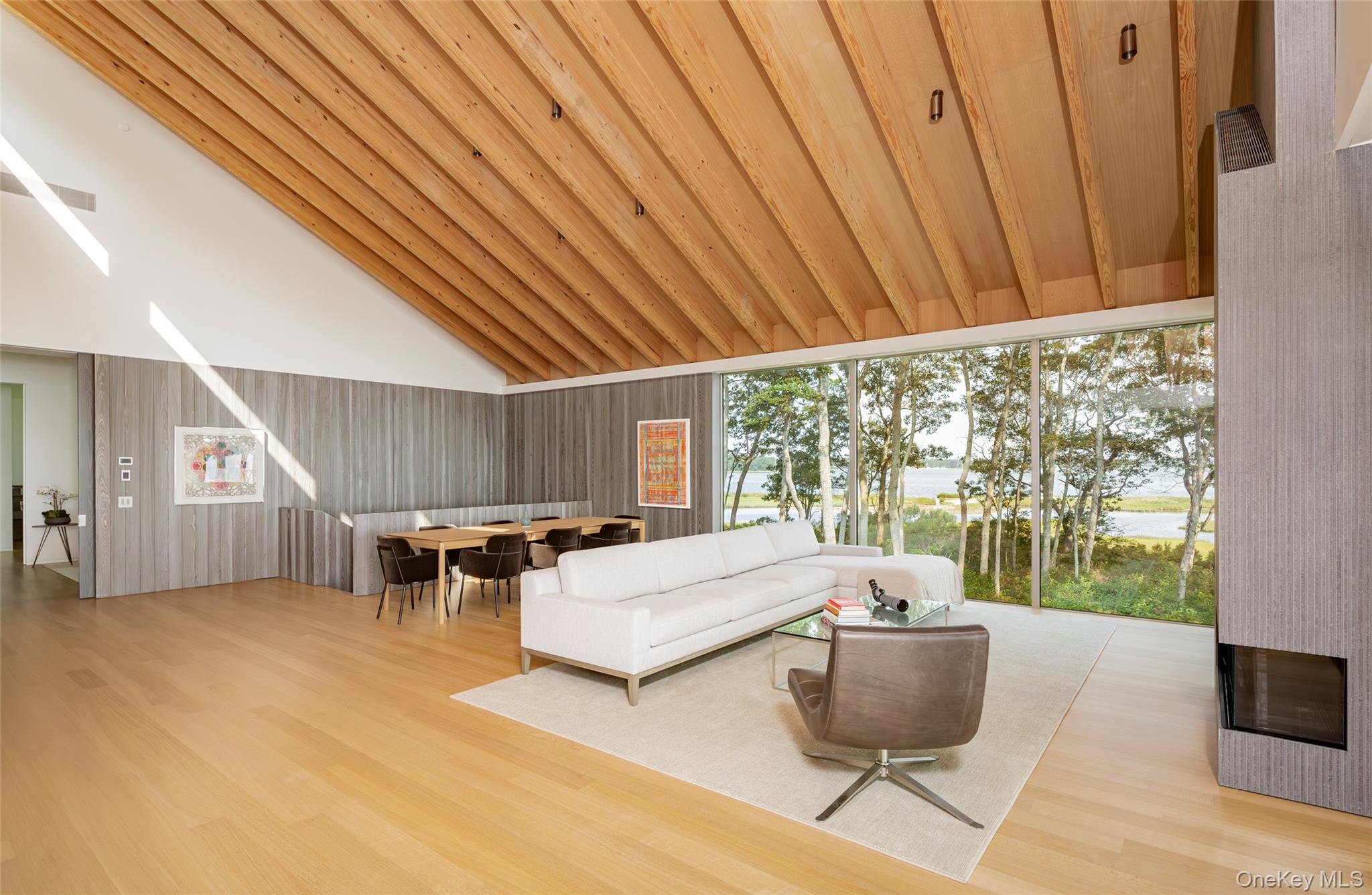 47 L South Ferry Road Shelter Island, NY 11964 - Photo 8 of 35 Living room featuring light wood-style flooring, high vaulted ceiling, wooden ceiling, and a water view