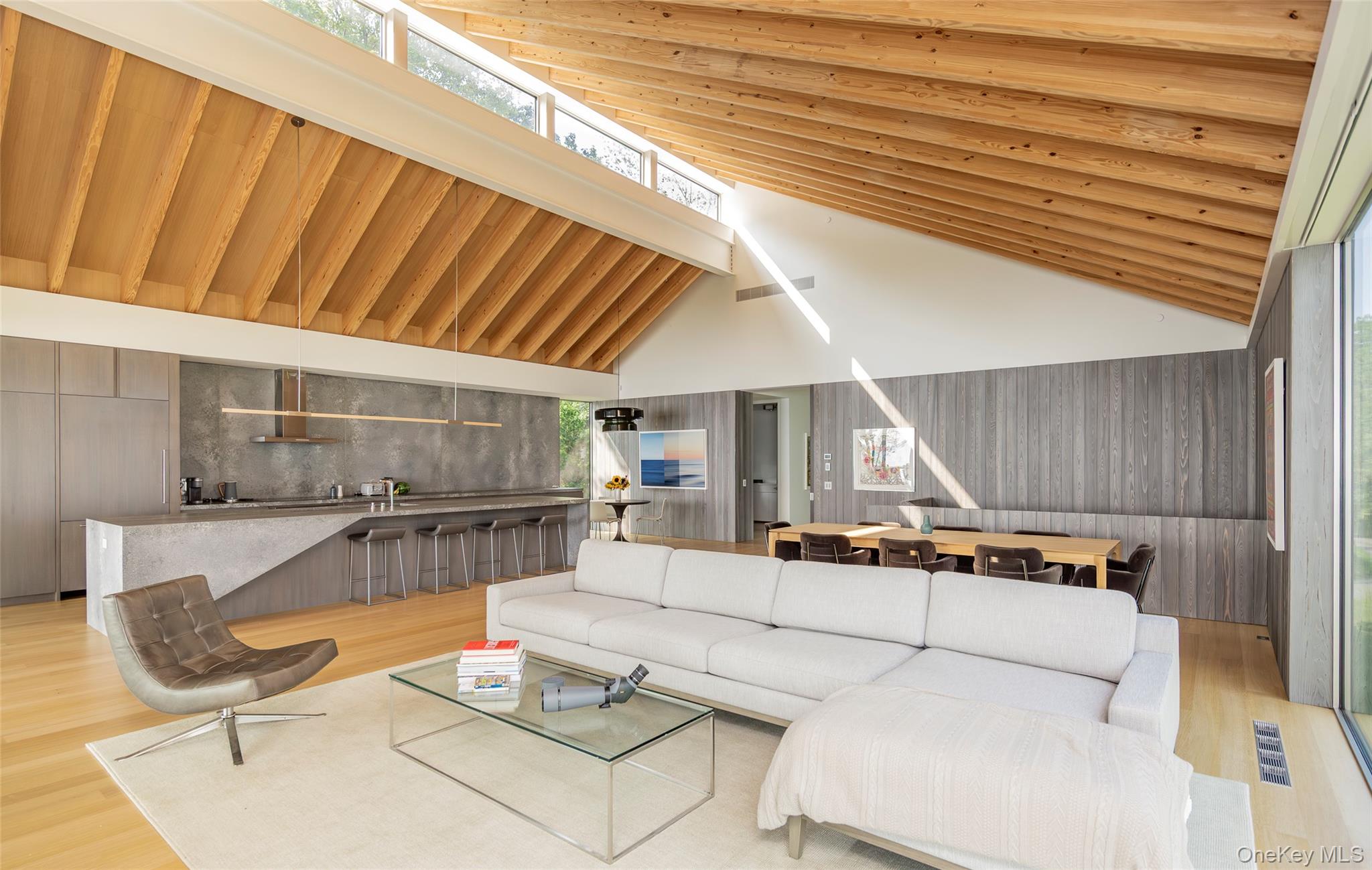 47 L South Ferry Road Shelter Island, NY 11964 - Photo 10 of 35 Living room with wood finished floors and high vaulted ceiling