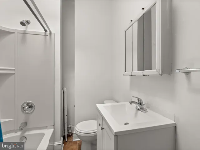 a bathroom with a sink toilet and vanity