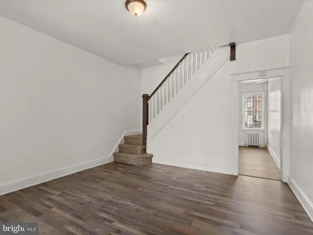 a view of entryway with wooden floor