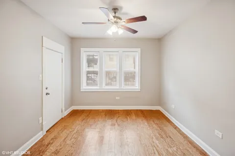 wooden floor in a room next to a window