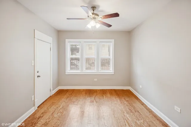 wooden floor in a room next to a window