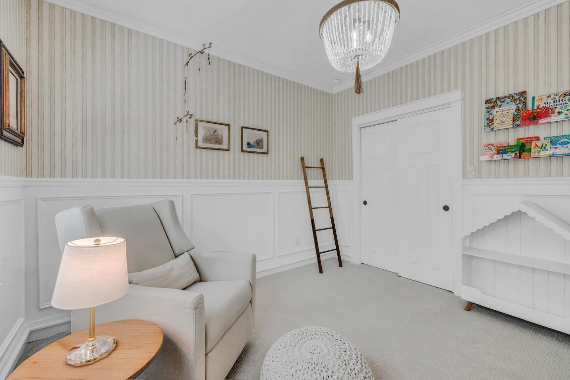 5832 Darling Street, Unit 5 Houston, TX 77007 - Photo 23 of 28 a bedroom with furniture and a chandelier