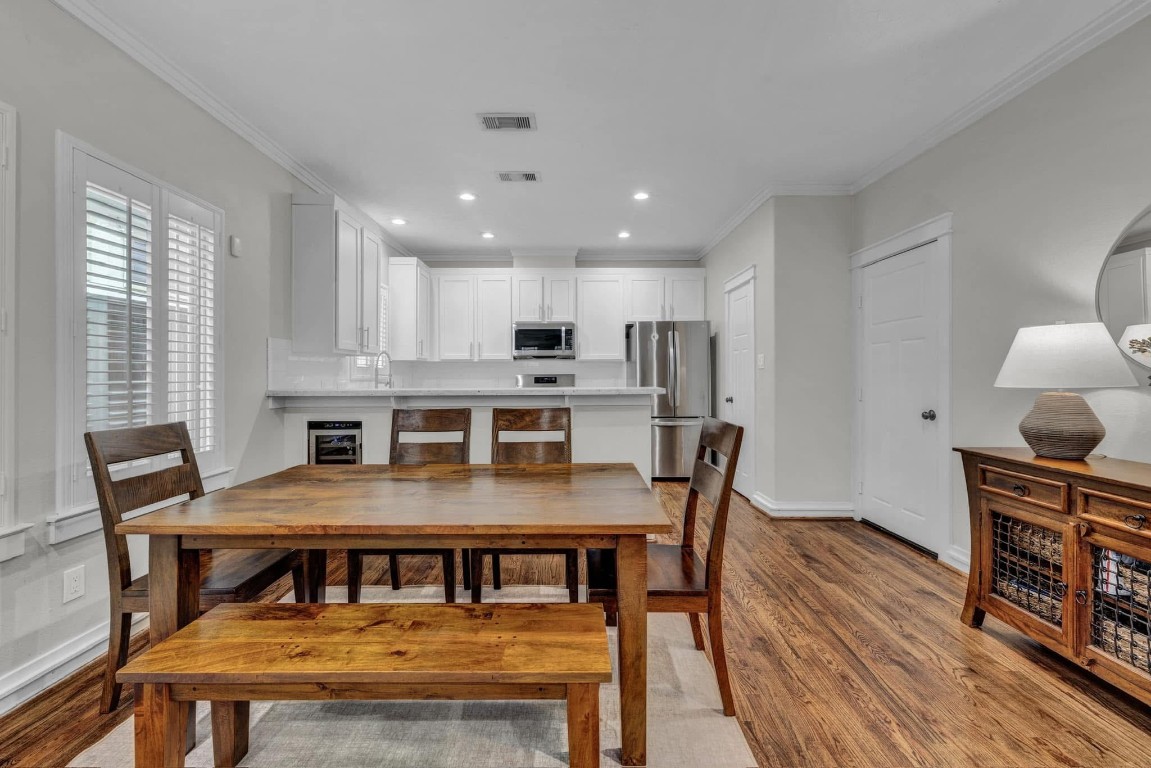 5832 Darling Street, Unit 5 Houston, TX 77007 - Photo 10 of 28 a view of a dining room with furniture window and wooden floor