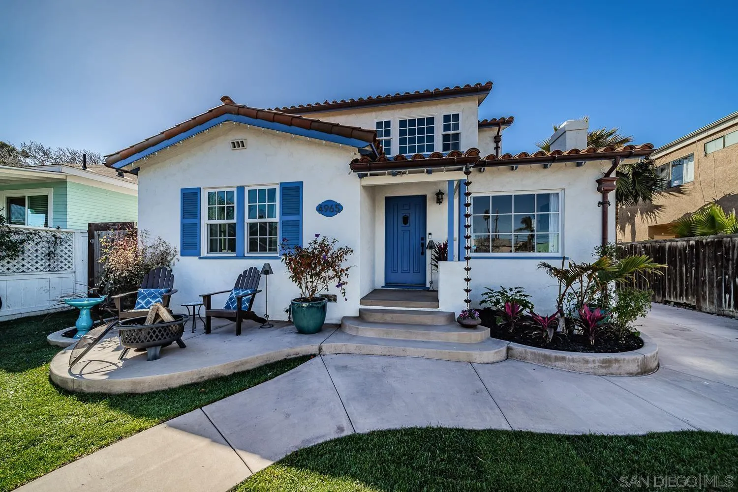 4965 Brighton Avenue Ocean Beach, CA 92107 - Photo 1 of 48 a front view of a house with a yard outdoor seating and mountain view
