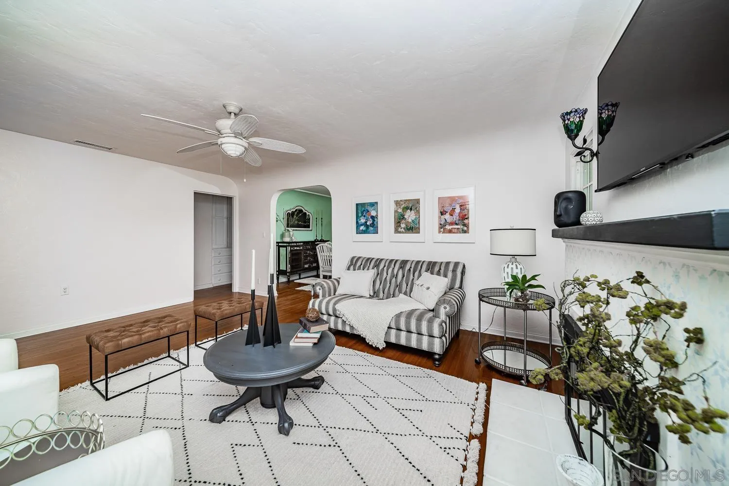 4965 Brighton Avenue Ocean Beach, CA 92107 - Photo 14 of 48 a living room with furniture and a chandelier