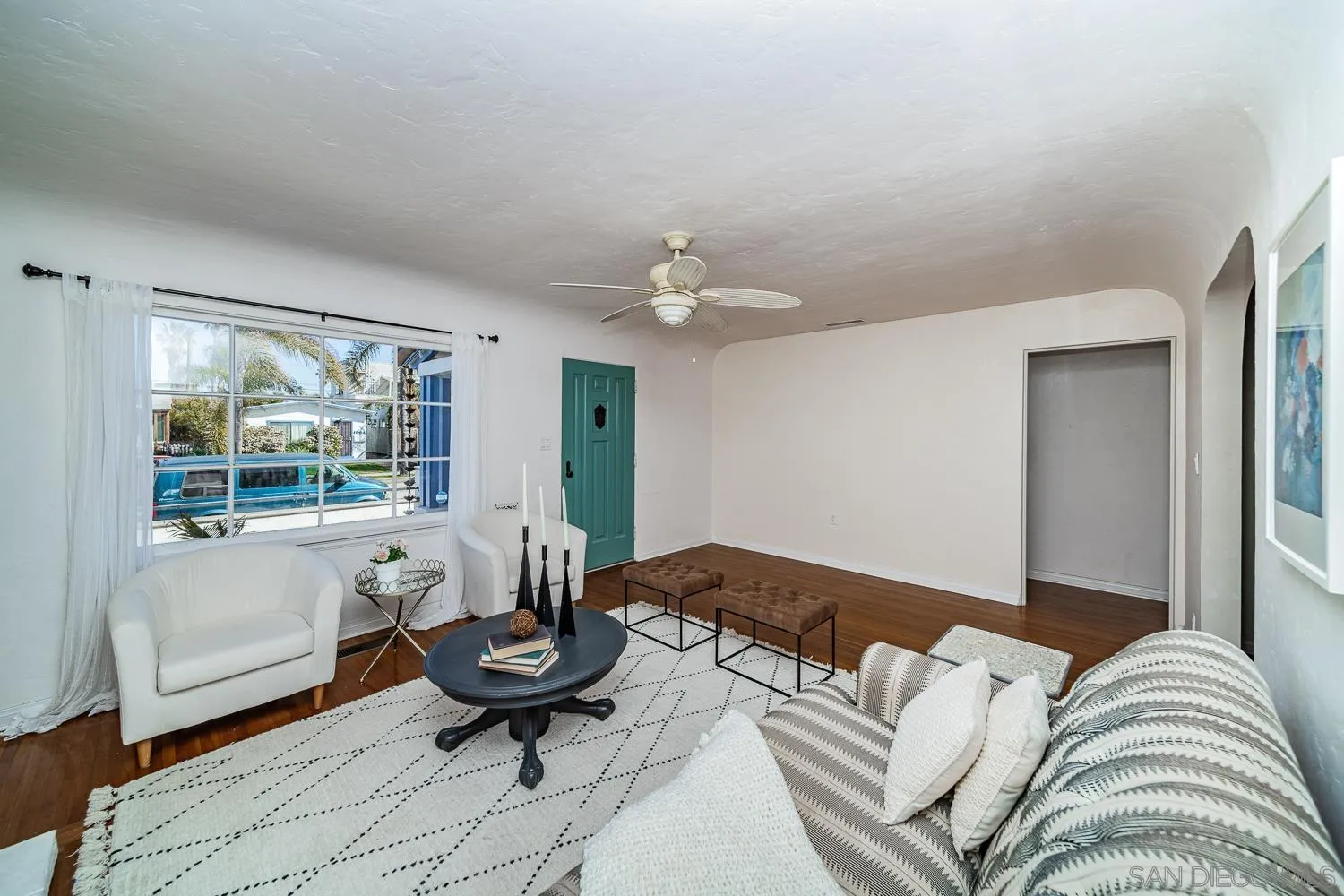 4965 Brighton Avenue Ocean Beach, CA 92107 - Photo 15 of 48 a living room with furniture and a large window